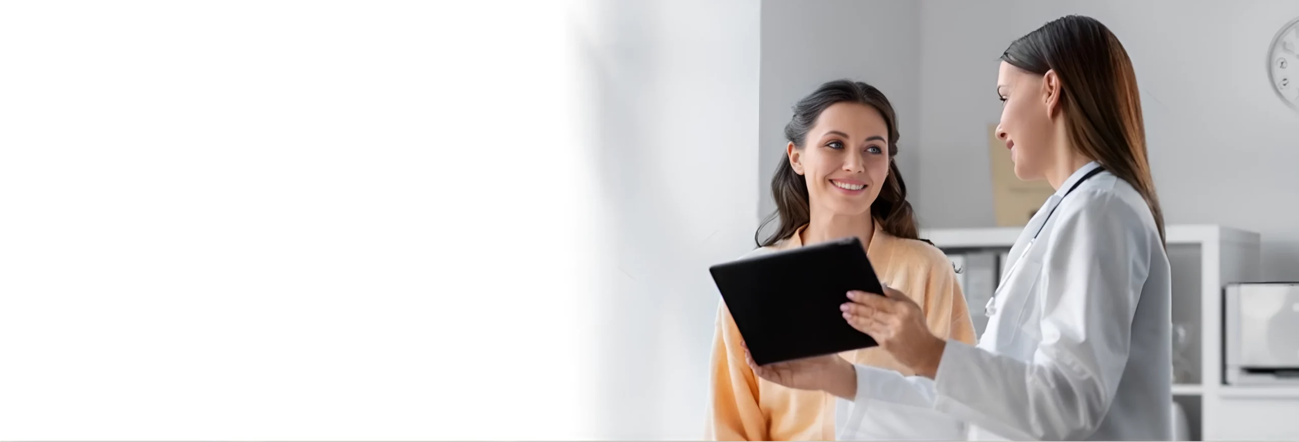 Woman in consultation with a doctor showing results